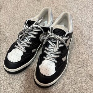 Women’s Gucci Black and White Sneakers